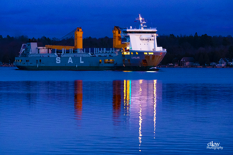 Caroline freighter ship dusk reflection St. Lawrence River Great Lakes Seaway