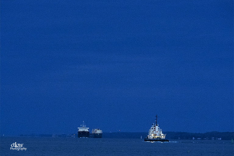tugboat Ocean A Gauthier two meeting freighters dusk St. Lawrence River Great Lakes Seaway